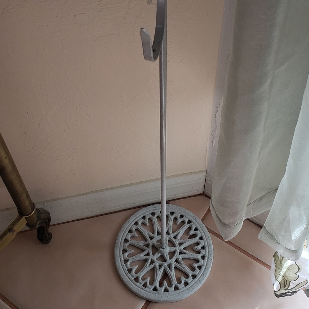 2 white wrought iron stands